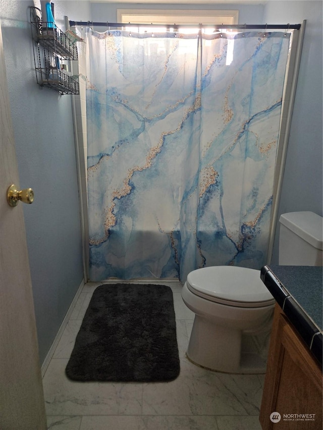 bathroom with tile patterned floors, vanity, and toilet