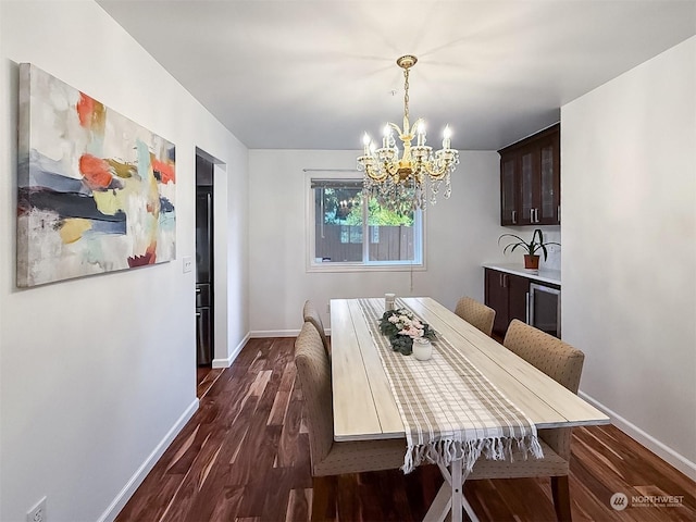 dining room featuring a chandelier, beverage cooler, and dark wood-type flooring