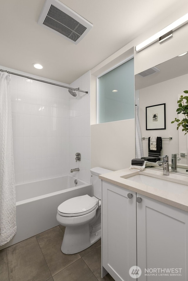 bathroom with tile patterned flooring, visible vents, toilet, shower / bath combination with curtain, and vanity