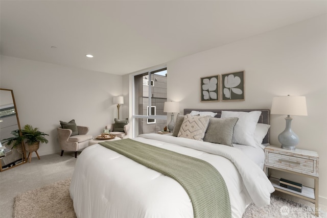 bedroom featuring recessed lighting, light colored carpet, and baseboards