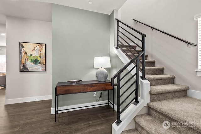 staircase featuring hardwood / wood-style floors