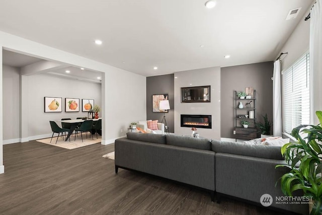 living room featuring dark wood-type flooring