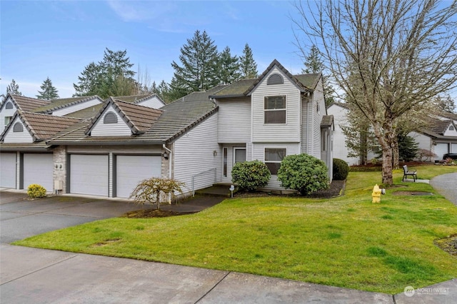 front of property featuring a garage and a front lawn