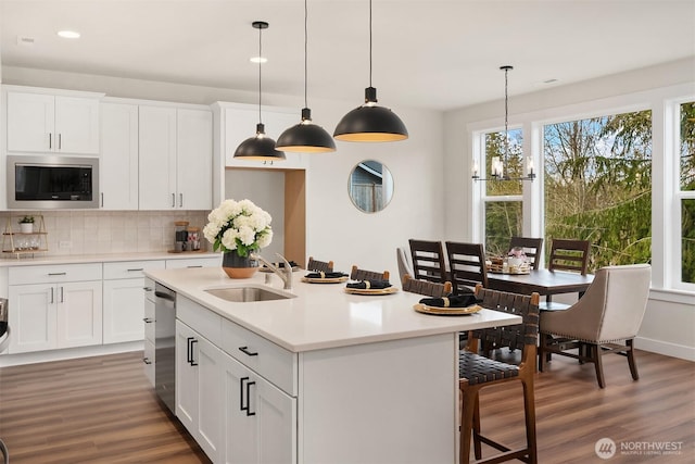 21416 116th Ave SE Unit 5, Kent, WA 98031 - kitchen featuring stainless steel appliances, light wood finished floors, backsplash, light countertops, and recessed lighting