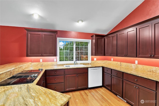 kitchen featuring lofted ceiling, sink, white dishwasher, light hardwood / wood-style floors, and black electric cooktop