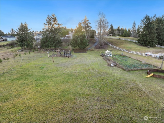 view of yard with a rural view