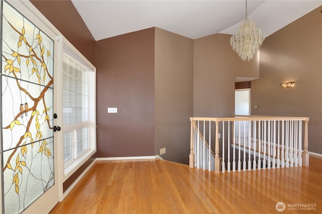 interior space featuring hardwood / wood-style flooring and a chandelier