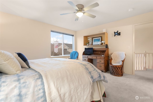 bedroom with ceiling fan and light colored carpet