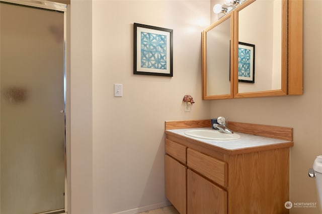 bathroom with vanity and an enclosed shower