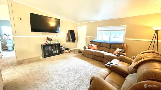 living room with carpet floors, lofted ceiling, and ornamental molding