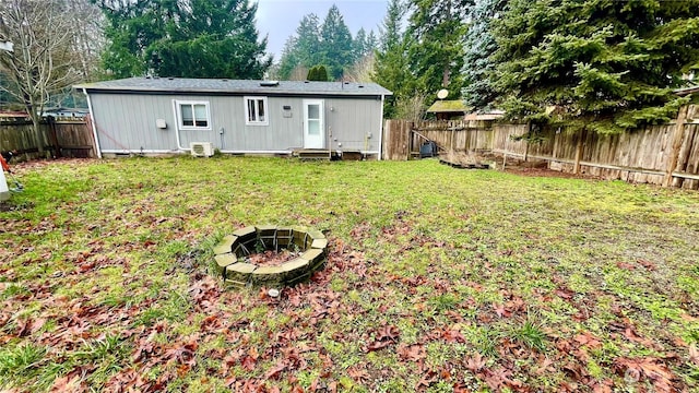 rear view of property with a lawn