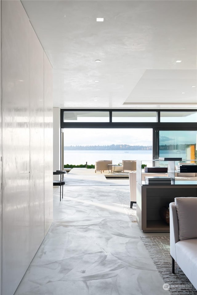 5505 Lake Washington Blvd NE Unit 1-D, Kirkland, WA 98033 - hallway with a wall of windows and a water view