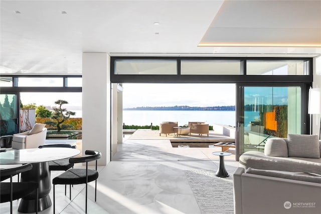 5505 Lake Washington Blvd NE Unit 1-D, Kirkland, WA 98033 - doorway with floor to ceiling windows, a water view, and finished concrete floors
