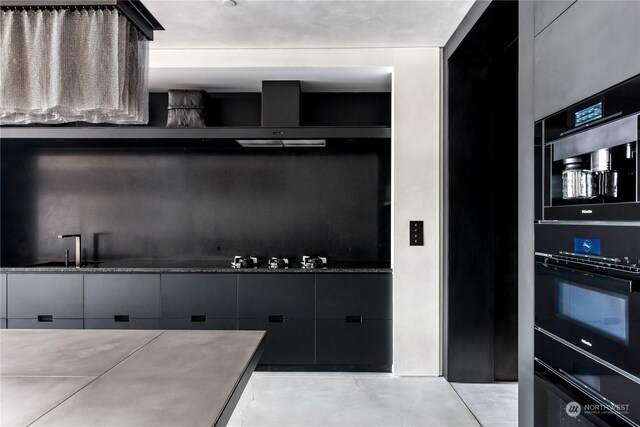 5505 Lake Washington Blvd NE Unit 1-D, Kirkland, WA 98033 - kitchen featuring dark cabinetry and cooktop