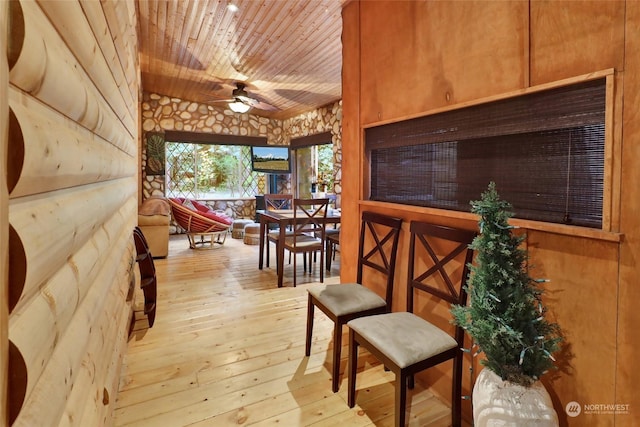 interior space featuring light hardwood / wood-style floors and wood ceiling