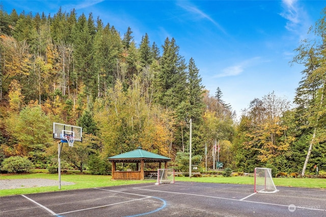 view of sport court with a gazebo