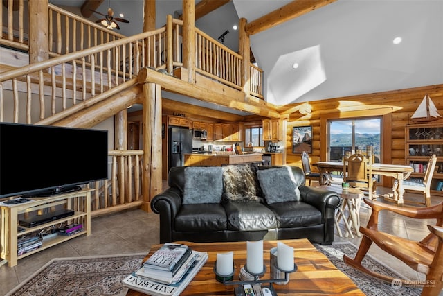 living room featuring beam ceiling, dark tile patterned floors, high vaulted ceiling, and ceiling fan