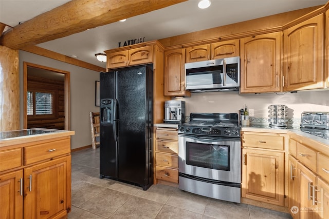 kitchen featuring light tile patterned floors and appliances with stainless steel finishes