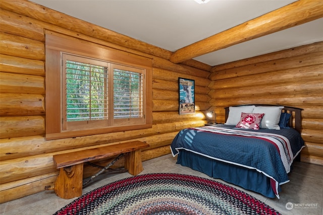 bedroom featuring log walls