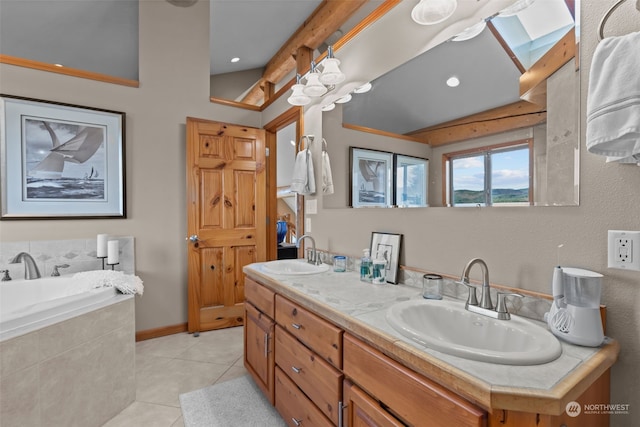 bathroom featuring tile patterned floors, vanity, a bathing tub, and vaulted ceiling