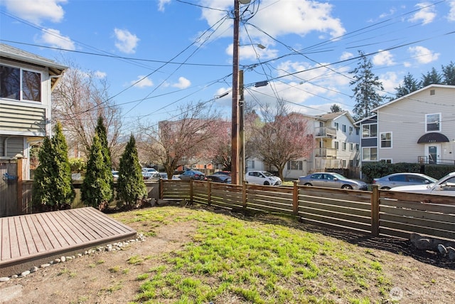 view of yard with a residential view and fence