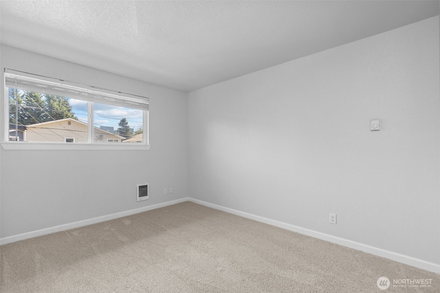 1128 N 91st St, Seattle, WA 98103 - carpeted spare room with baseboards and a textured ceiling