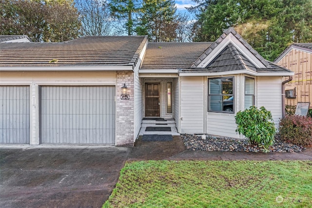 single story home with a garage