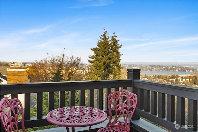 wooden deck with a water view