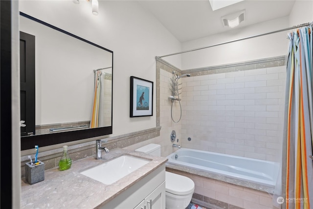 full bathroom with shower / bath combo, toilet, and vanity