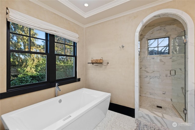 bathroom featuring separate shower and tub and ornamental molding