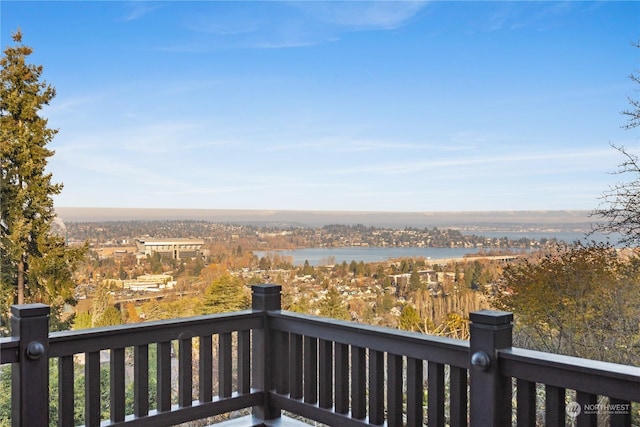 wooden terrace featuring a water view