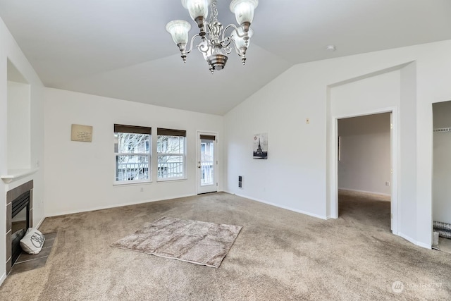 unfurnished living room with carpet flooring, a chandelier, and vaulted ceiling