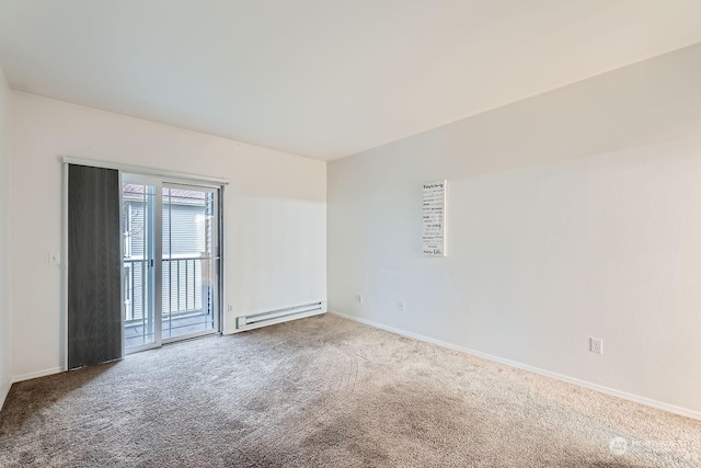 carpeted spare room with a baseboard radiator