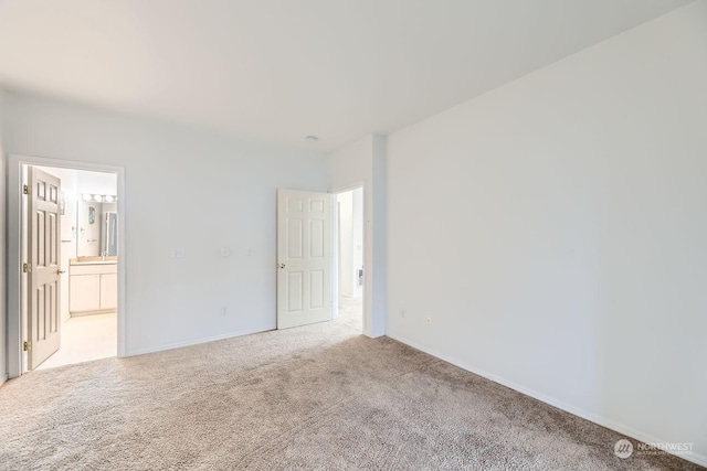 spare room with light carpet