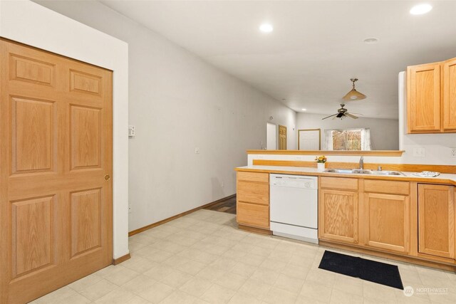 kitchen featuring ceiling fan, sink, white dishwasher, and light brown cabinets