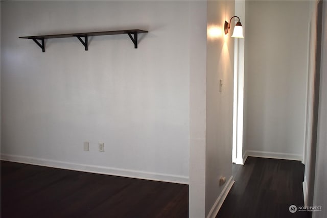 spare room with dark hardwood / wood-style flooring