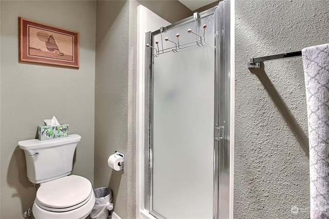 bathroom with walk in shower and toilet