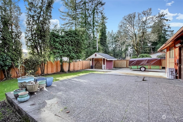 view of patio featuring a shed