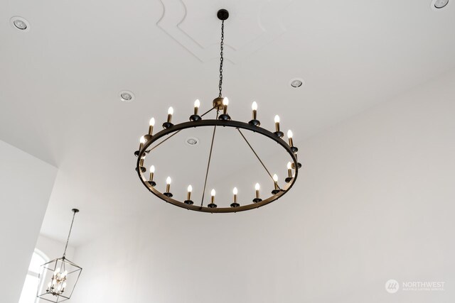 interior details featuring an inviting chandelier