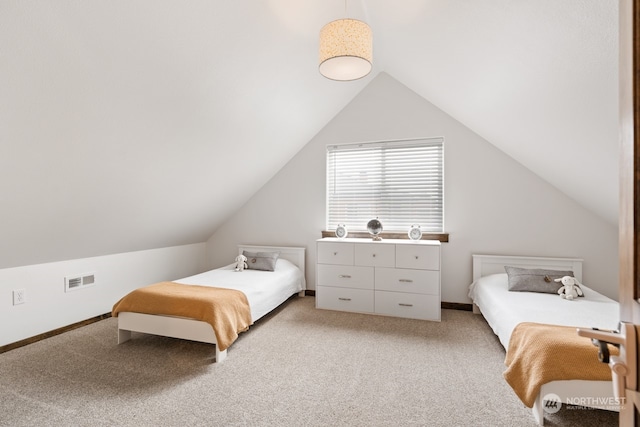 bedroom featuring light colored carpet and vaulted ceiling