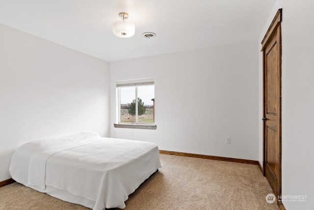 bedroom featuring carpet