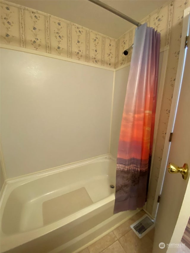 bathroom featuring shower / tub combo with curtain and tile patterned floors