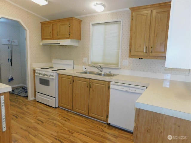 kitchen with ornamental molding, sink, white appliances, and light wood-type flooring