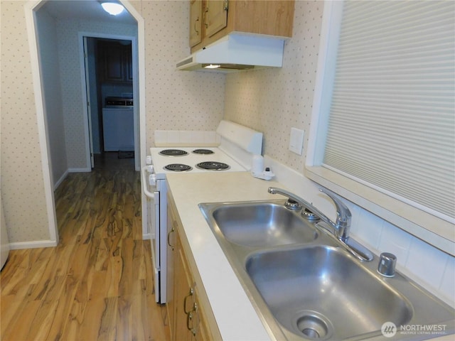 kitchen featuring sink, white electric range oven, and dark hardwood / wood-style floors