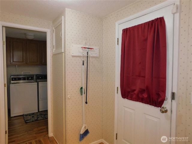 interior space with wood-type flooring and washing machine and clothes dryer