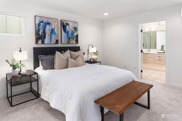 carpeted bedroom with ensuite bath