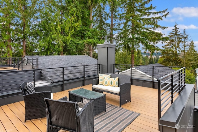 wooden terrace featuring outdoor lounge area