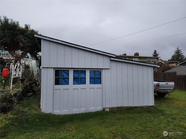 view of outdoor structure featuring a lawn