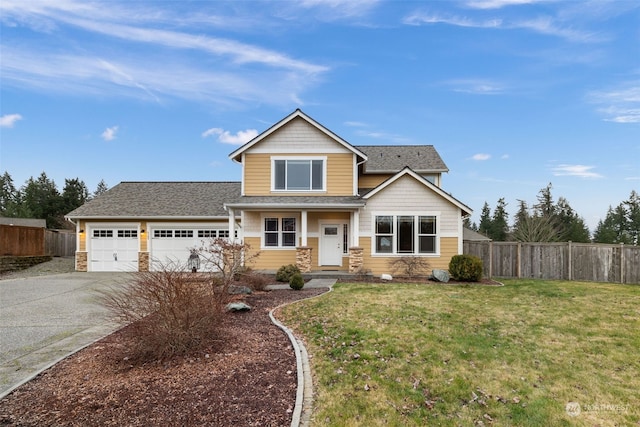 craftsman-style home with a front yard and a garage