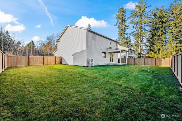 rear view of property with a lawn